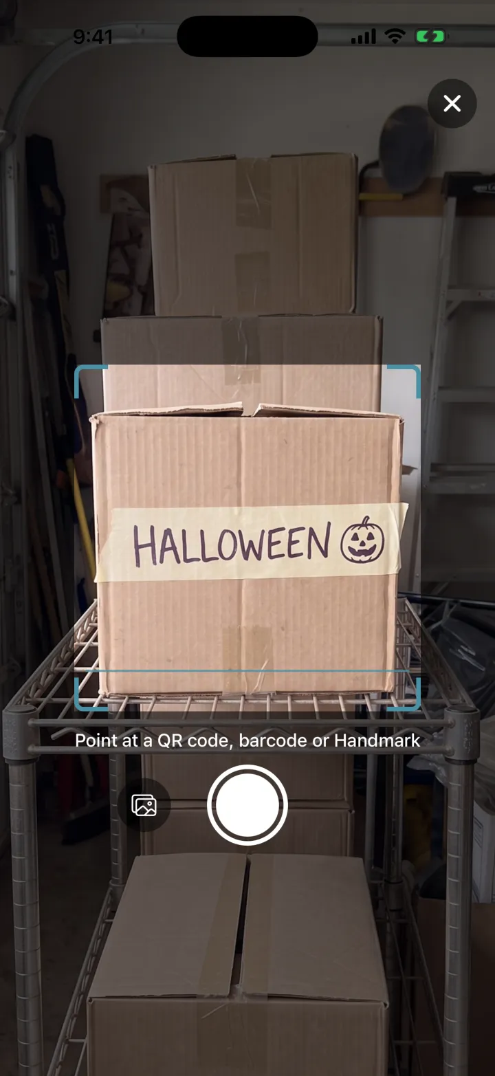 Cratify Scan pointed at a box labeled HALLOWEEN in marker