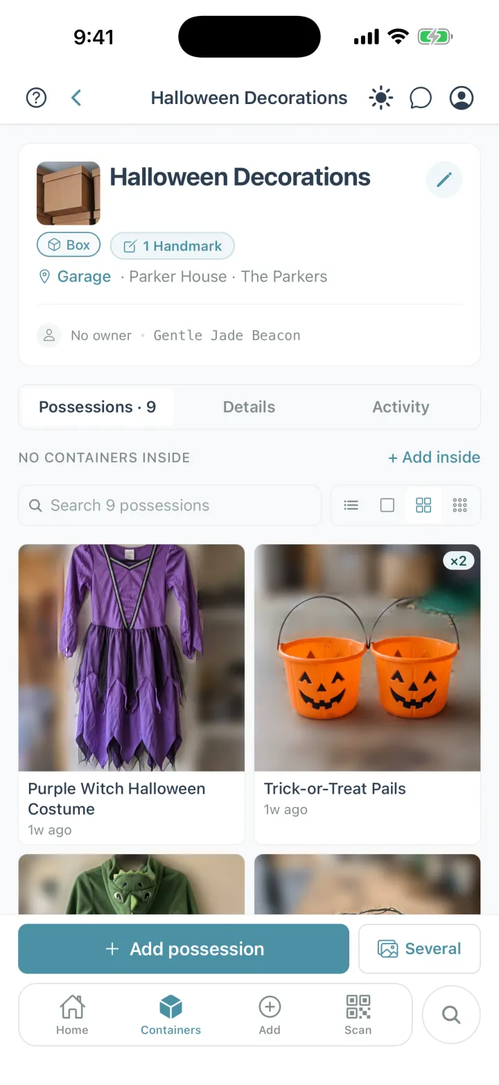 Cratify showing the Halloween Decorations box in the Garage at Parker House, with 1 Handmark and 9 possessions inside, including a purple witch costume and a pair of trick-or-treat pails